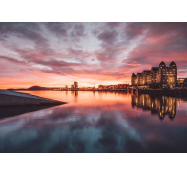 Fotomural ciudad reflejo del paisaje urbano al atardecer - TenVinilo