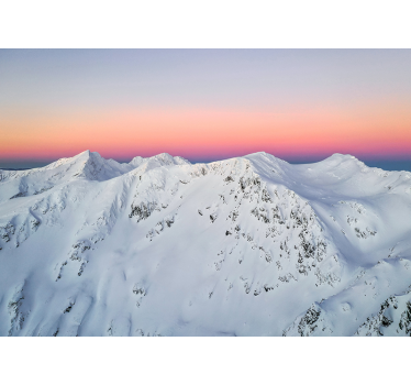 Fotomural montañas atardecer en picos nevados - TenVinilo