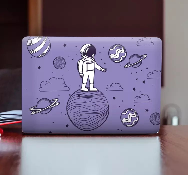 Pegatina para portátil astronauta en el planeta - TenVinilo