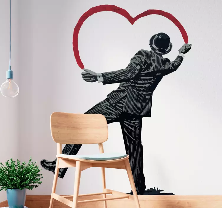 Vinilo pared salón Banksy personaje dibujando corazón - TenVinilo