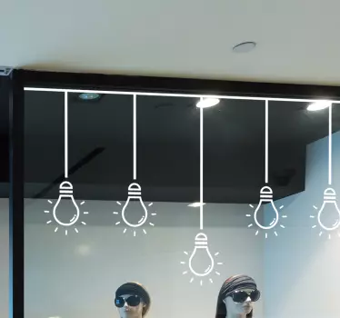 Vinilo escaparate instalaciones de iluminación suspendida - TenVinilo