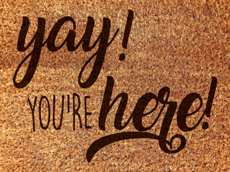 Alfombra vinílica entrada frase de cálida bienvenida - TenVinilo